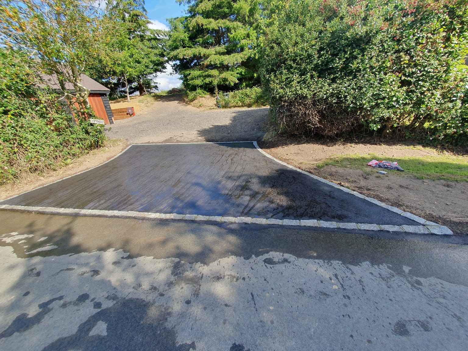 Completed tarmac entrance with stone edging